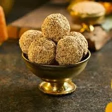 Nutty, sweet Nuvvla Laddu, made with sesame seeds, jaggery, and cardamom. A traditional, healthy Indian sweet perfect for celebrations. Nutty, sweet Nuvvla Laddu, made with sesame seeds, jaggery, and cardamom. A traditional, healthy Indian sweet perfect for celebrations.