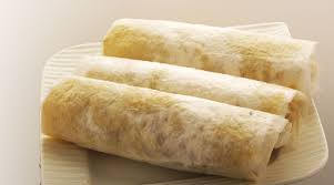 Sugar Puthrekulu - Crispy and sweet Indian treat made with rice flour, sugar, and cardamom, perfect for festivals and celebrations.