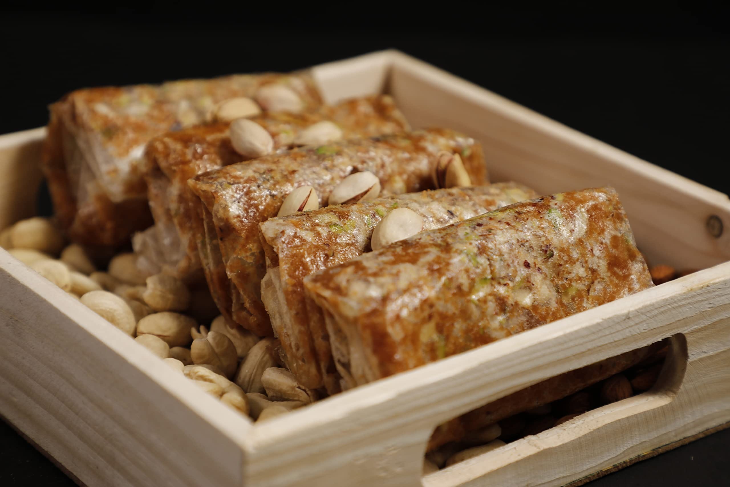 Mixed Dry Fruits Puthrekulu - A crispy, nut-filled Indian sweet made with cashews, almonds, pistachios, and rice flour, perfect for festivals.