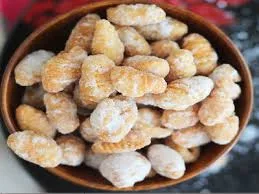Sugar Guvvalu - Crispy dumplings made with rice flour and sugar, coated in a sweet syrup, a traditional Indian sweet for festivals.