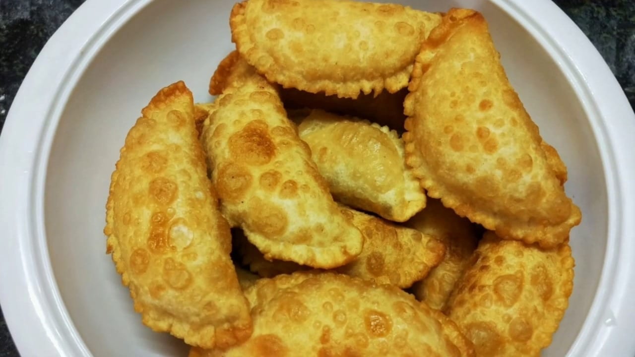 Pappula Kajjikayalu - Crispy, deep-fried pastry filled with a sweet roasted gram mixture.