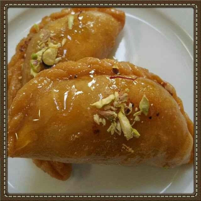 Kajjikayalu with Kova - Crispy fried dough filled with creamy Kova (reduced milk), a traditional Indian sweet perfect for festivals.